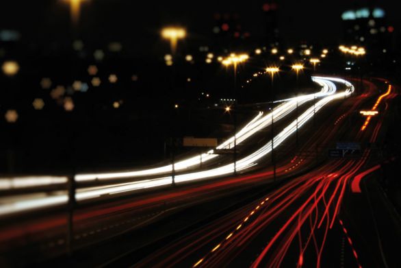 Highway with light trails from cars