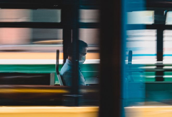 Man on bus with face mask