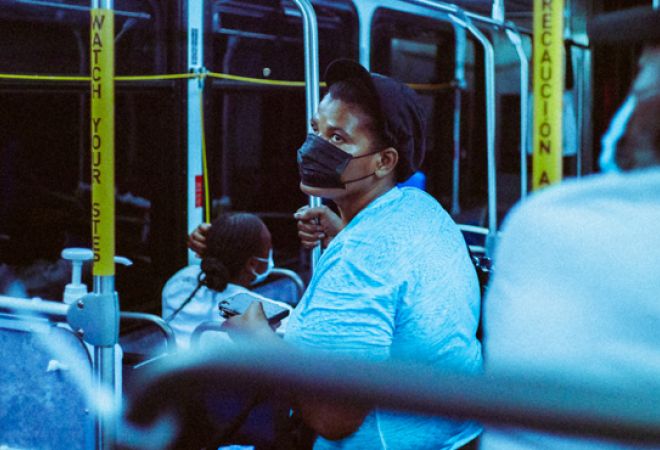 Person with face mask on a bus