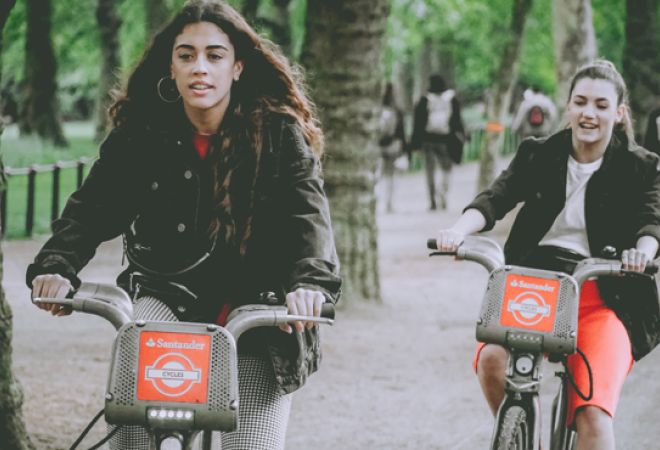 Three women on Santander bikes