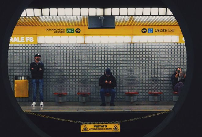 Passengers waiting for a train in Milan